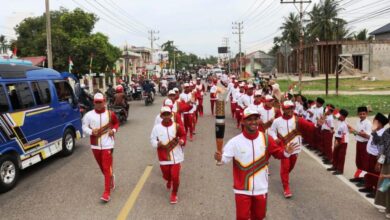 Top Skor PON Papua Pimpin Arak-arakan Obor di Aceh Timur